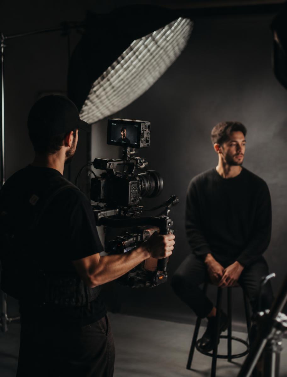 Behind the scenes of a video shoot with cinema camera